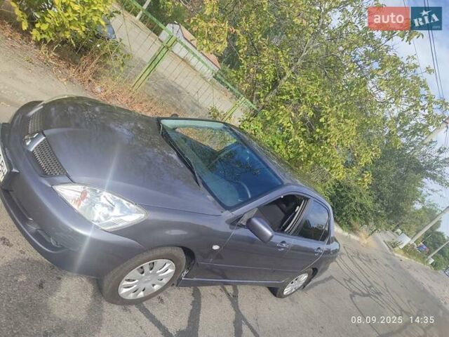 Сірий Міцубісі Lancer, об'ємом двигуна 1.6 л та пробігом 242 тис. км за 4900 $, фото 1 на Automoto.ua