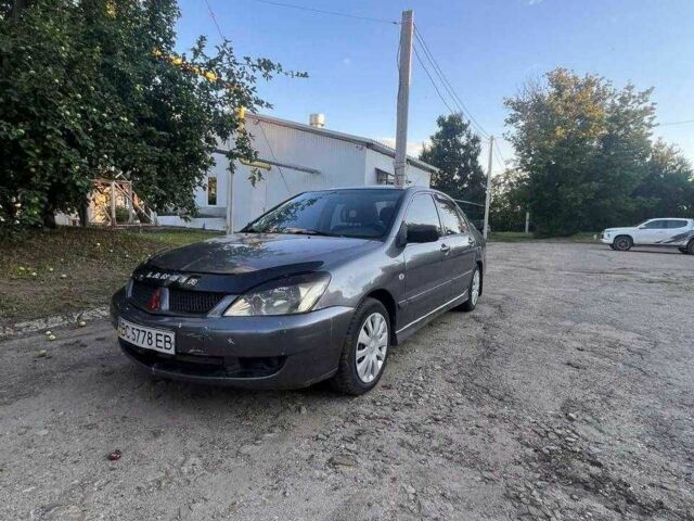 Сірий Міцубісі Lancer, об'ємом двигуна 1.6 л та пробігом 245 тис. км за 2497 $, фото 1 на Automoto.ua