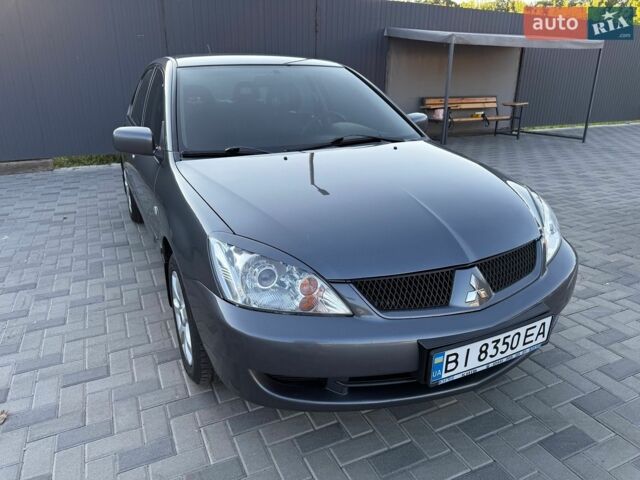 Сірий Міцубісі Lancer, об'ємом двигуна 1.6 л та пробігом 170 тис. км за 5000 $, фото 1 на Automoto.ua