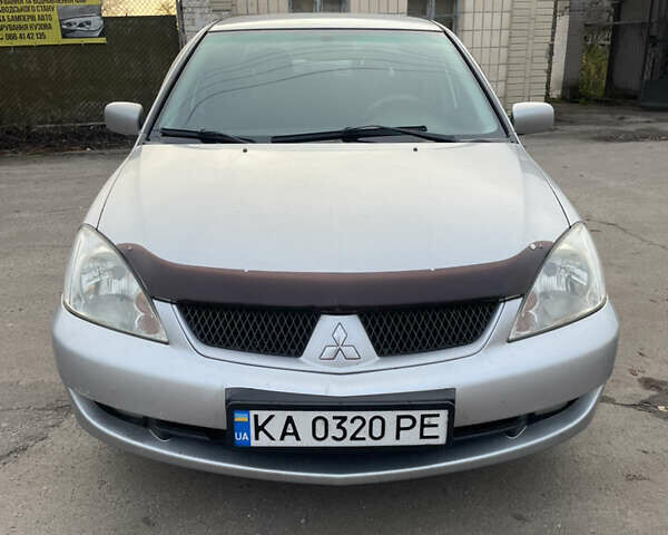 Сірий Міцубісі Lancer, об'ємом двигуна 1.58 л та пробігом 430 тис. км за 2550 $, фото 1 на Automoto.ua