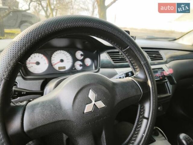 Серый Мицубиси Лансер, объемом двигателя 1.6 л и пробегом 234 тыс. км за 4300 $, фото 1 на Automoto.ua