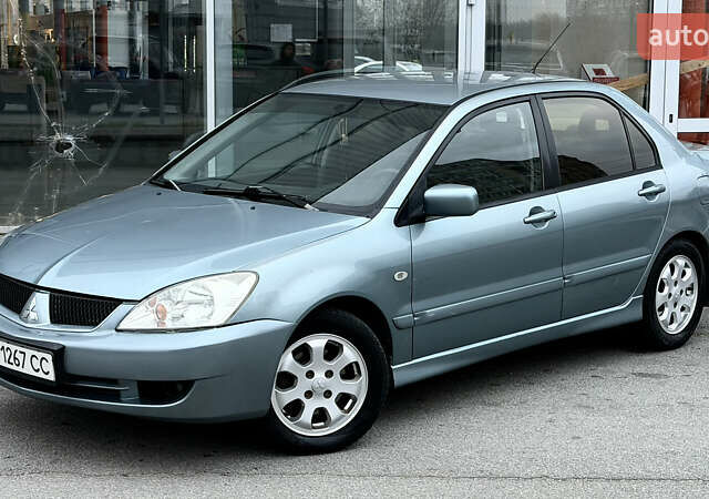 Сірий Міцубісі Lancer, об'ємом двигуна 1.58 л та пробігом 275 тис. км за 4600 $, фото 1 на Automoto.ua
