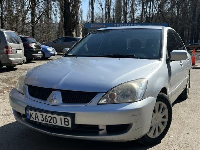 Серый Мицубиси Лансер, объемом двигателя 1.6 л и пробегом 385 тыс. км за 3200 $, фото 1 на Automoto.ua