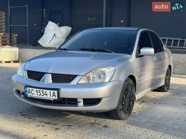 Сірий Міцубісі Lancer, об'ємом двигуна 1.58 л та пробігом 303 тис. км за 2800 $, фото 1 на Automoto.ua