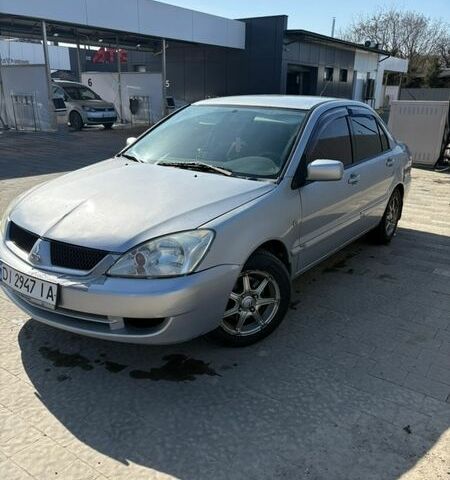 Серый Мицубиси Лансер, объемом двигателя 1.58 л и пробегом 307 тыс. км за 3600 $, фото 1 на Automoto.ua