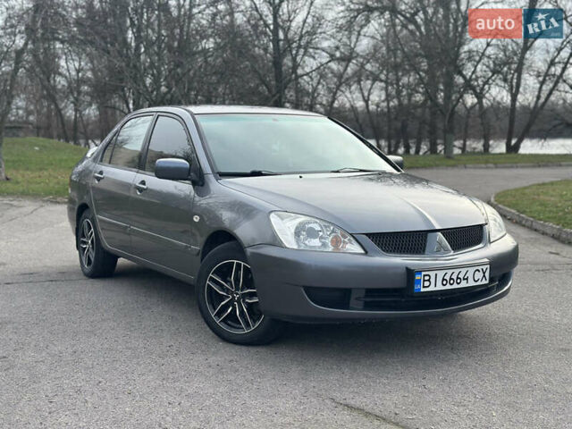 Сірий Міцубісі Lancer, об'ємом двигуна 1.58 л та пробігом 332 тис. км за 4650 $, фото 1 на Automoto.ua