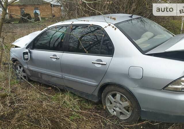 Сірий Міцубісі Lancer, об'ємом двигуна 1.58 л та пробігом 140 тис. км за 1400 $, фото 1 на Automoto.ua