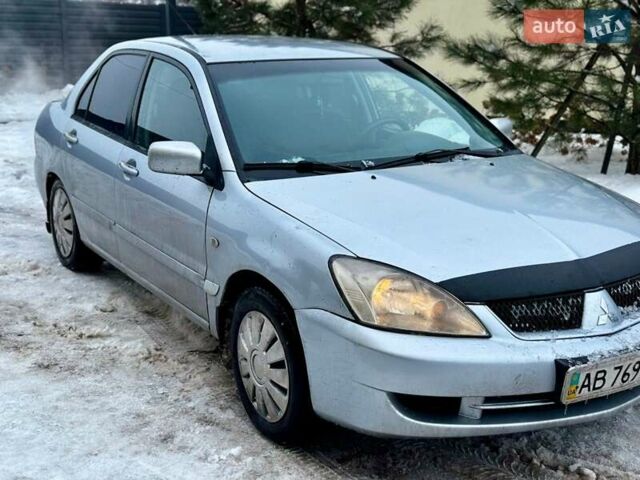 Серый Мицубиси Лансер, объемом двигателя 1.58 л и пробегом 333 тыс. км за 3000 $, фото 1 на Automoto.ua