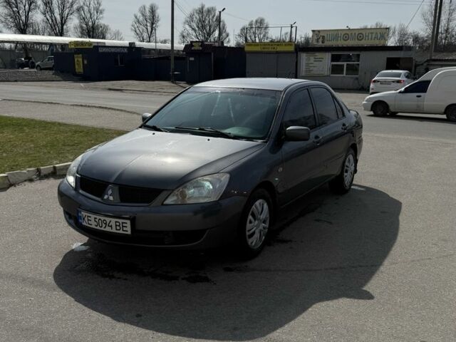 Серый Мицубиси Лансер, объемом двигателя 1.6 л и пробегом 240 тыс. км за 2550 $, фото 1 на Automoto.ua