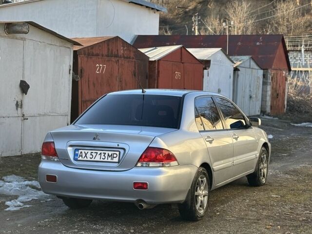 Серый Мицубиси Лансер, объемом двигателя 1.6 л и пробегом 287 тыс. км за 3750 $, фото 1 на Automoto.ua