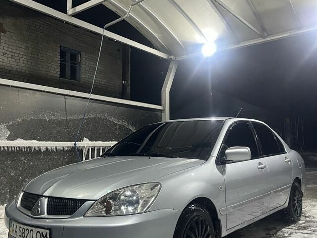Сірий Міцубісі Lancer, об'ємом двигуна 1.6 л та пробігом 410 тис. км за 2100 $, фото 1 на Automoto.ua