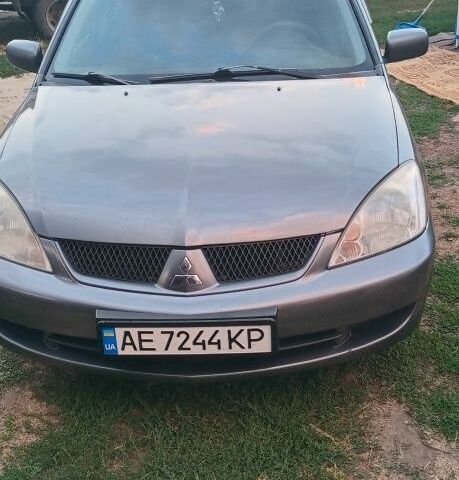 Серый Мицубиси Лансер, объемом двигателя 1.6 л и пробегом 270 тыс. км за 3700 $, фото 1 на Automoto.ua