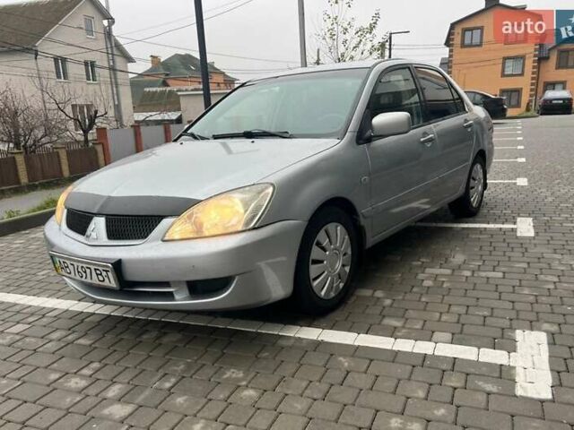 Серый Мицубиси Лансер, объемом двигателя 1.6 л и пробегом 333 тыс. км за 2800 $, фото 1 на Automoto.ua