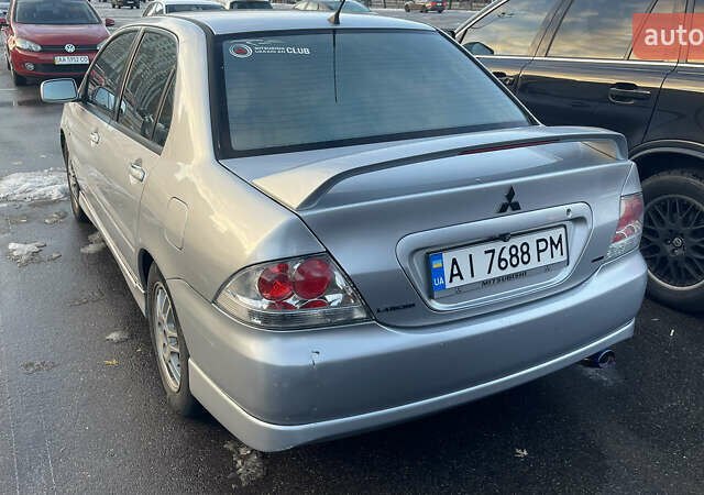 Серый Мицубиси Лансер, объемом двигателя 2 л и пробегом 307 тыс. км за 3999 $, фото 1 на Automoto.ua