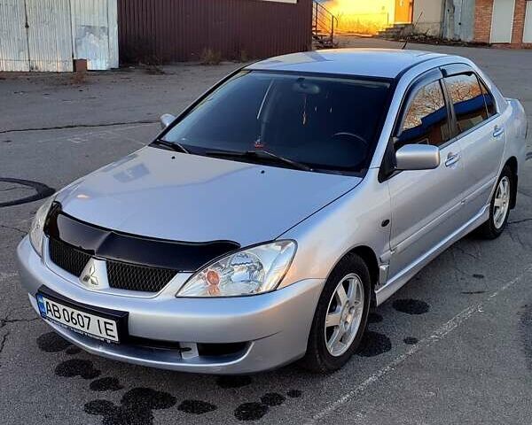 Сірий Міцубісі Lancer, об'ємом двигуна 1.58 л та пробігом 207 тис. км за 4300 $, фото 1 на Automoto.ua