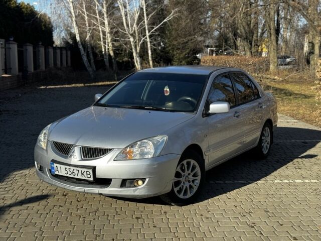 Серый Мицубиси Лансер, объемом двигателя 1.6 л и пробегом 220 тыс. км за 3900 $, фото 1 на Automoto.ua