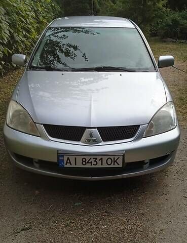 Серый Мицубиси Лансер, объемом двигателя 1.6 л и пробегом 260 тыс. км за 3600 $, фото 1 на Automoto.ua