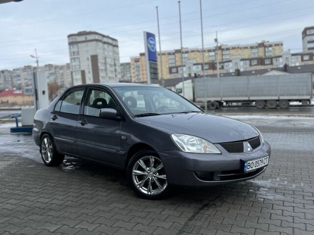 Серый Мицубиси Лансер, объемом двигателя 1.6 л и пробегом 212 тыс. км за 3150 $, фото 1 на Automoto.ua