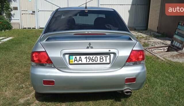 Серый Мицубиси Лансер, объемом двигателя 1.6 л и пробегом 395 тыс. км за 4800 $, фото 1 на Automoto.ua