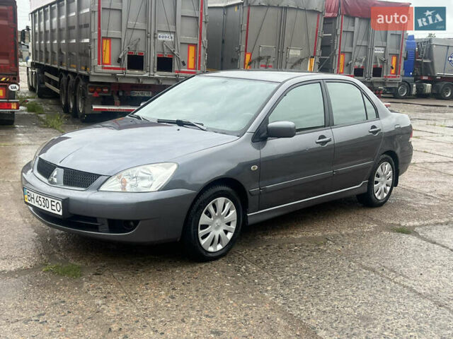 Серый Мицубиси Лансер, объемом двигателя 1.6 л и пробегом 193 тыс. км за 4700 $, фото 1 на Automoto.ua