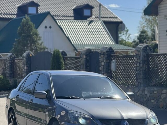 Серый Мицубиси Лансер, объемом двигателя 1.6 л и пробегом 284 тыс. км за 3500 $, фото 1 на Automoto.ua