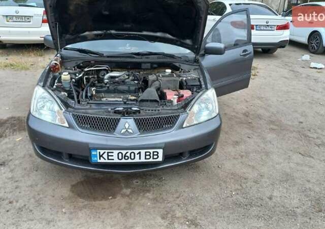 Серый Мицубиси Лансер, объемом двигателя 1.58 л и пробегом 271 тыс. км за 4600 $, фото 1 на Automoto.ua