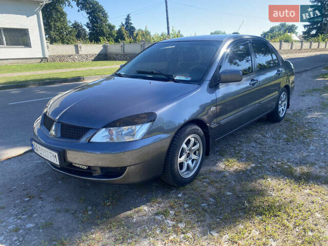 Серый Мицубиси Лансер, объемом двигателя 1.6 л и пробегом 291 тыс. км за 3900 $, фото 1 на Automoto.ua