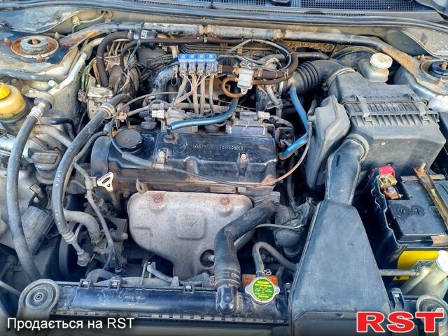 Серый Мицубиси Лансер, объемом двигателя 1.6 л и пробегом 235 тыс. км за 4600 $, фото 1 на Automoto.ua