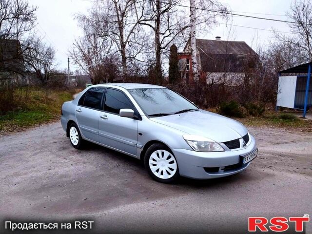 Серый Мицубиси Лансер, объемом двигателя 1.6 л и пробегом 300 тыс. км за 3600 $, фото 1 на Automoto.ua