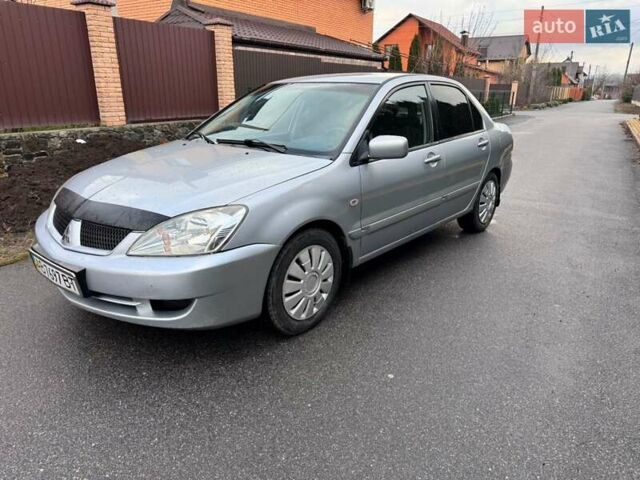 Сірий Міцубісі Lancer, об'ємом двигуна 1.58 л та пробігом 333 тис. км за 2999 $, фото 1 на Automoto.ua