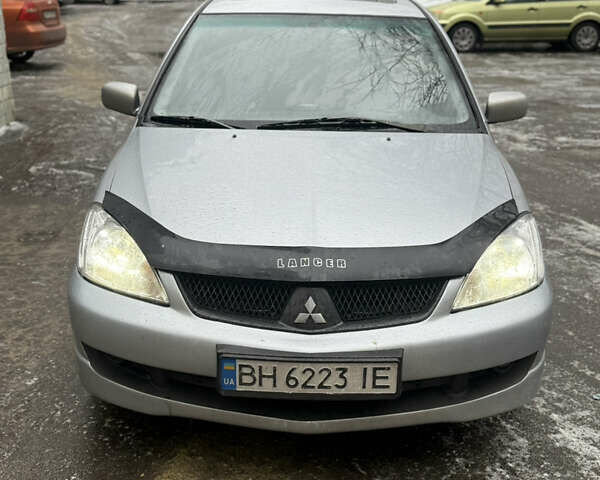 Серый Мицубиси Лансер, объемом двигателя 2 л и пробегом 226 тыс. км за 4900 $, фото 1 на Automoto.ua