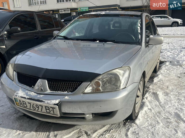 Серый Мицубиси Лансер, объемом двигателя 1.58 л и пробегом 333 тыс. км за 2550 $, фото 1 на Automoto.ua