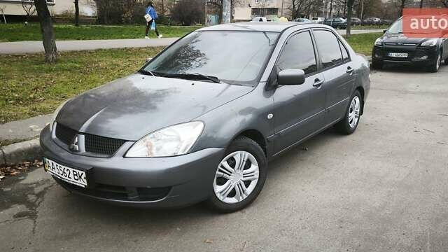 Серый Мицубиси Лансер, объемом двигателя 1.6 л и пробегом 263 тыс. км за 3650 $, фото 1 на Automoto.ua