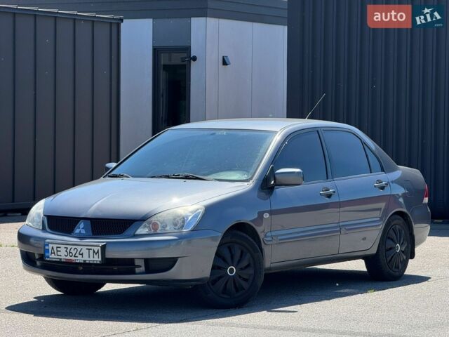 Сірий Міцубісі Lancer, об'ємом двигуна 1.6 л та пробігом 235 тис. км за 4700 $, фото 1 на Automoto.ua