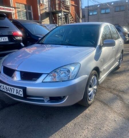 Серый Мицубиси Лансер, объемом двигателя 1.6 л и пробегом 213 тыс. км за 3699 $, фото 1 на Automoto.ua