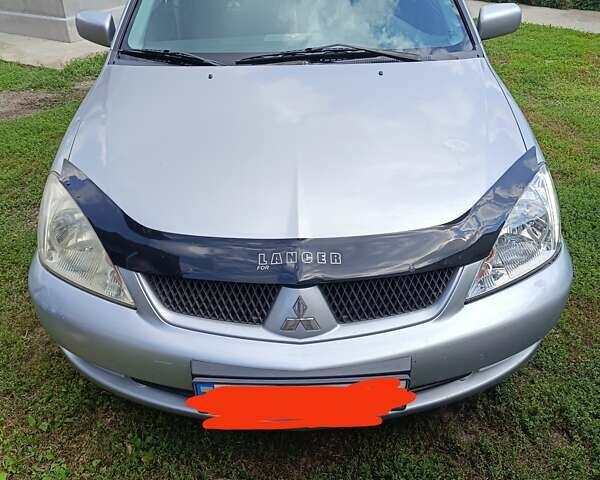 Серый Мицубиси Лансер, объемом двигателя 1.6 л и пробегом 200 тыс. км за 3100 $, фото 1 на Automoto.ua