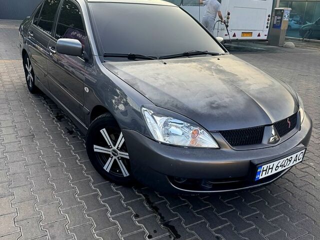 Серый Мицубиси Лансер, объемом двигателя 1.6 л и пробегом 0 тыс. км за 4000 $, фото 1 на Automoto.ua