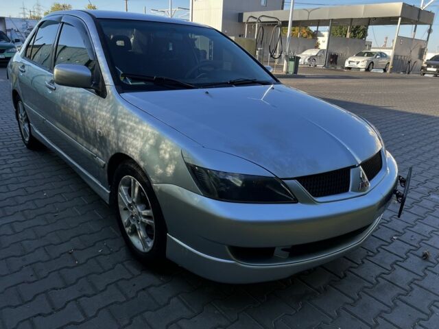 Сірий Міцубісі Lancer, об'ємом двигуна 2 л та пробігом 192 тис. км за 5400 $, фото 1 на Automoto.ua