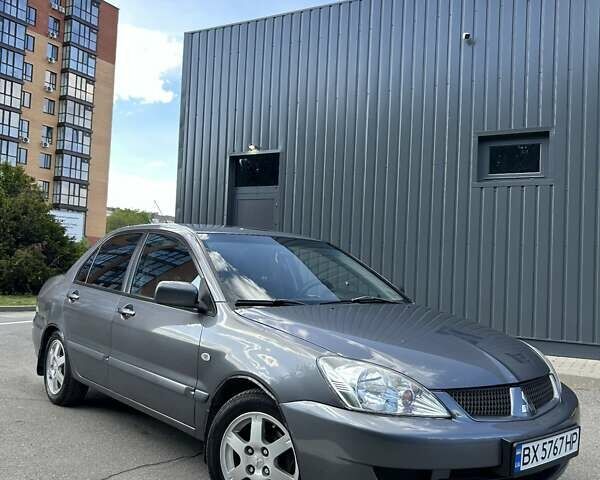 Сірий Міцубісі Lancer, об'ємом двигуна 1.58 л та пробігом 160 тис. км за 4600 $, фото 1 на Automoto.ua