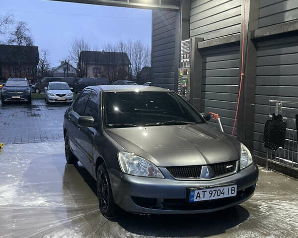 Серый Мицубиси Лансер, объемом двигателя 1.6 л и пробегом 213 тыс. км за 4500 $, фото 1 на Automoto.ua