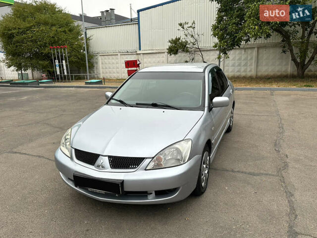 Серый Мицубиси Лансер, объемом двигателя 1.58 л и пробегом 183 тыс. км за 4800 $, фото 1 на Automoto.ua