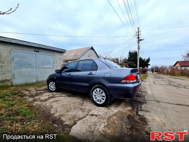 Сірий Міцубісі Lancer, об'ємом двигуна 1.6 л та пробігом 223 тис. км за 5450 $, фото 1 на Automoto.ua