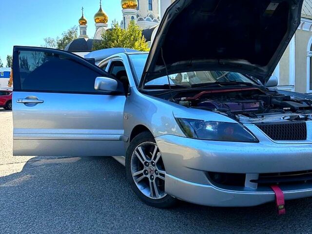 Серый Мицубиси Лансер, объемом двигателя 2 л и пробегом 0 тыс. км за 5500 $, фото 1 на Automoto.ua