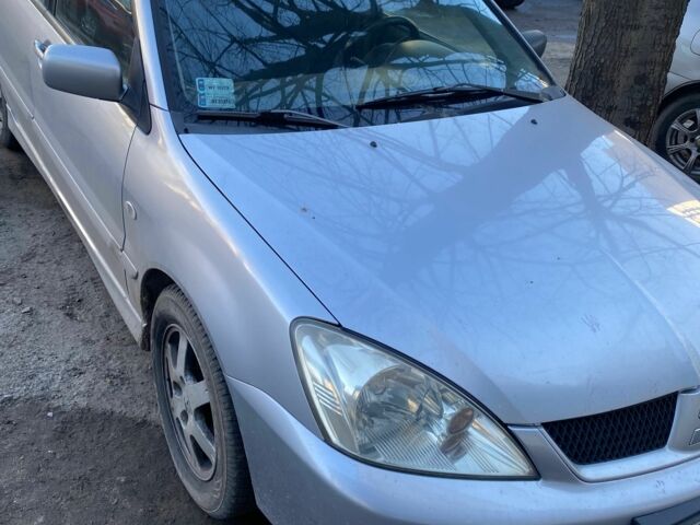 Серый Мицубиси Лансер, объемом двигателя 1.6 л и пробегом 350 тыс. км за 2200 $, фото 1 на Automoto.ua