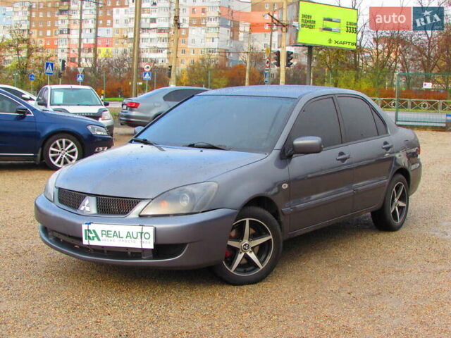 Серый Мицубиси Лансер, объемом двигателя 1.58 л и пробегом 300 тыс. км за 3600 $, фото 1 на Automoto.ua