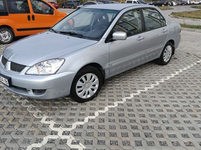 Сірий Міцубісі Lancer, об'ємом двигуна 1.6 л та пробігом 267 тис. км за 3600 $, фото 1 на Automoto.ua