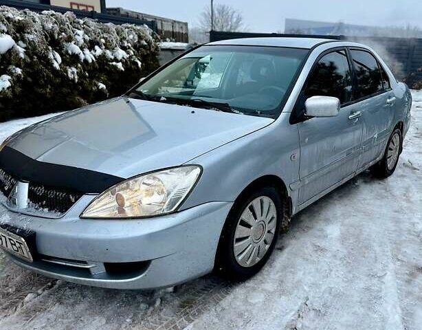 Серый Мицубиси Лансер, объемом двигателя 1.6 л и пробегом 333 тыс. км за 3000 $, фото 1 на Automoto.ua