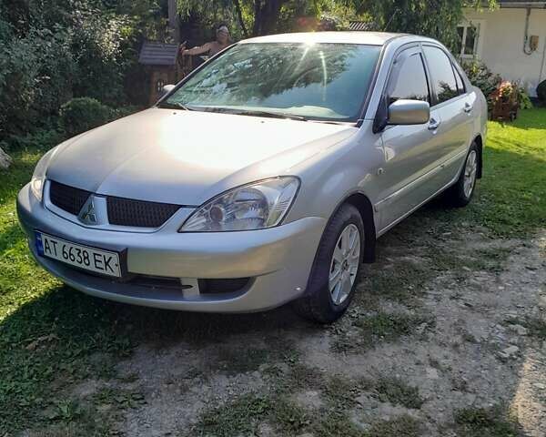 Сірий Міцубісі Lancer, об'ємом двигуна 1.58 л та пробігом 215 тис. км за 5200 $, фото 1 на Automoto.ua
