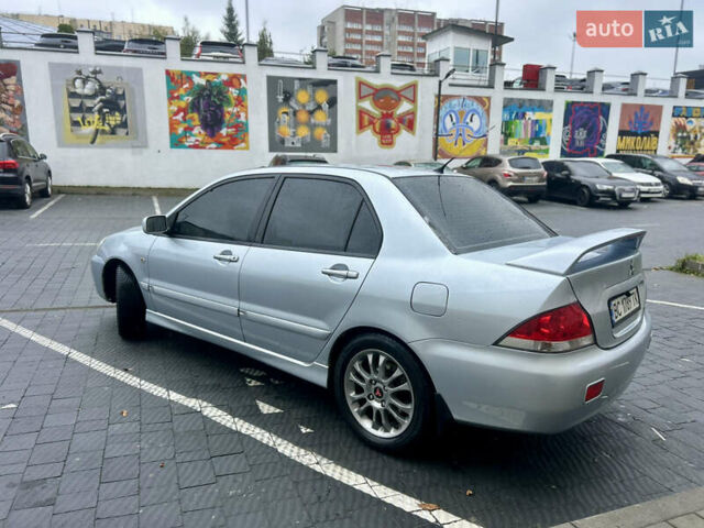 Сірий Міцубісі Lancer, об'ємом двигуна 1.58 л та пробігом 186 тис. км за 4699 $, фото 1 на Automoto.ua