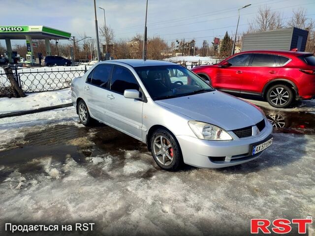 Сірий Міцубісі Lancer, об'ємом двигуна 1.6 л та пробігом 28600 тис. км за 3200 $, фото 1 на Automoto.ua